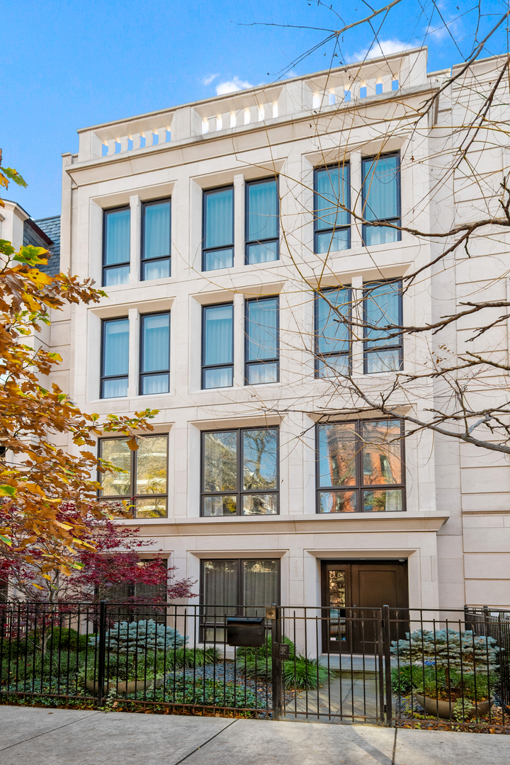453 West Deming Place Chicago, IL 60614 - Photo 1 of 50 a front view of a residential apartment building with a yard