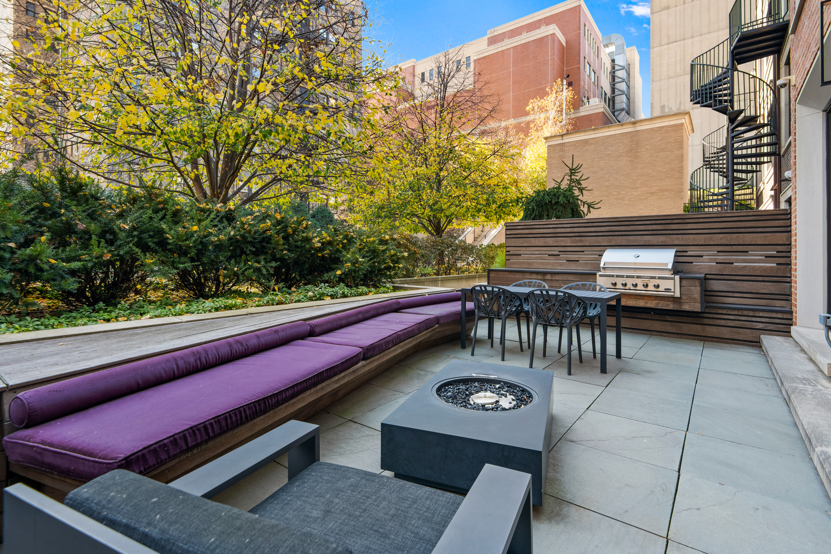 453 West Deming Place Chicago, IL 60614 - Photo 13 of 50 a roof deck with a table and chairs