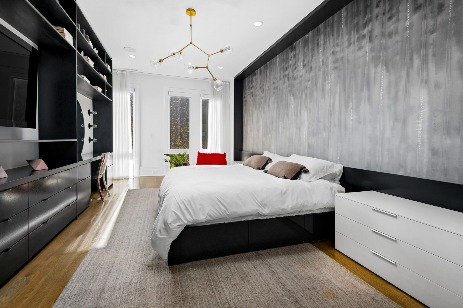 453 West Deming Place Chicago, IL 60614 - Photo 17 of 50 a bed room with a bed window and a flat screen tv