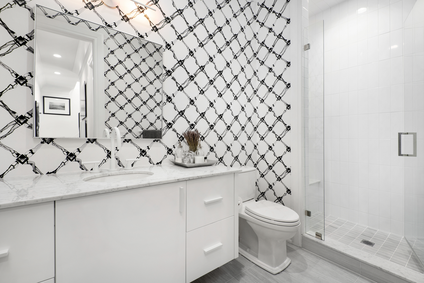 453 West Deming Place Chicago, IL 60614 - Photo 28 of 50 a bathroom with a granite countertop toilet and a sink