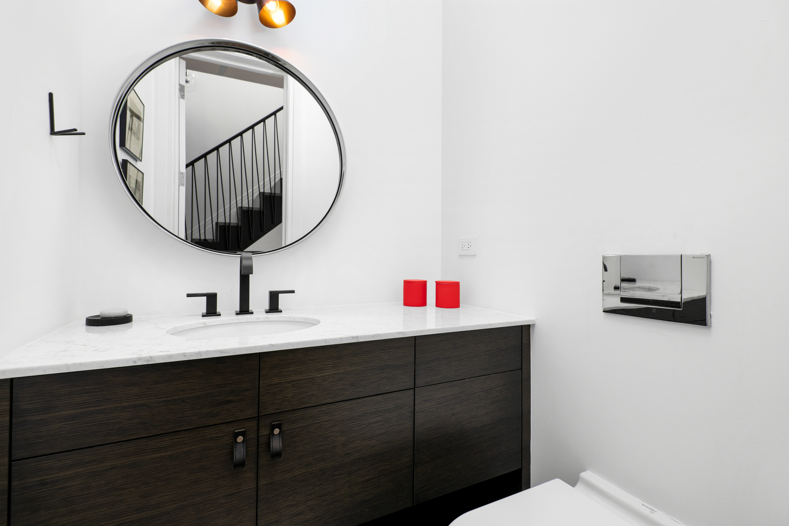 453 West Deming Place Chicago, IL 60614 - Photo 33 of 50 a bathroom with a sink a mirror and a toilet