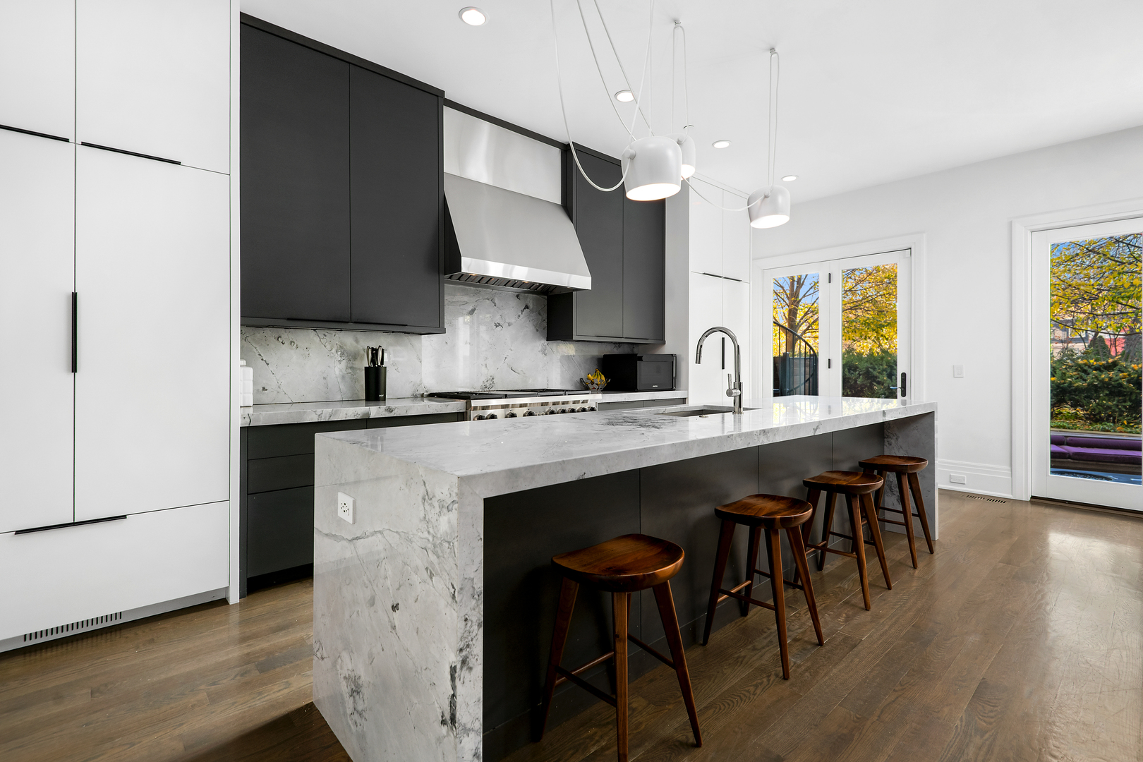 453 West Deming Place Chicago, IL 60614 - Photo 8 of 50 a kitchen with granite countertop a sink cabinets and wooden floor
