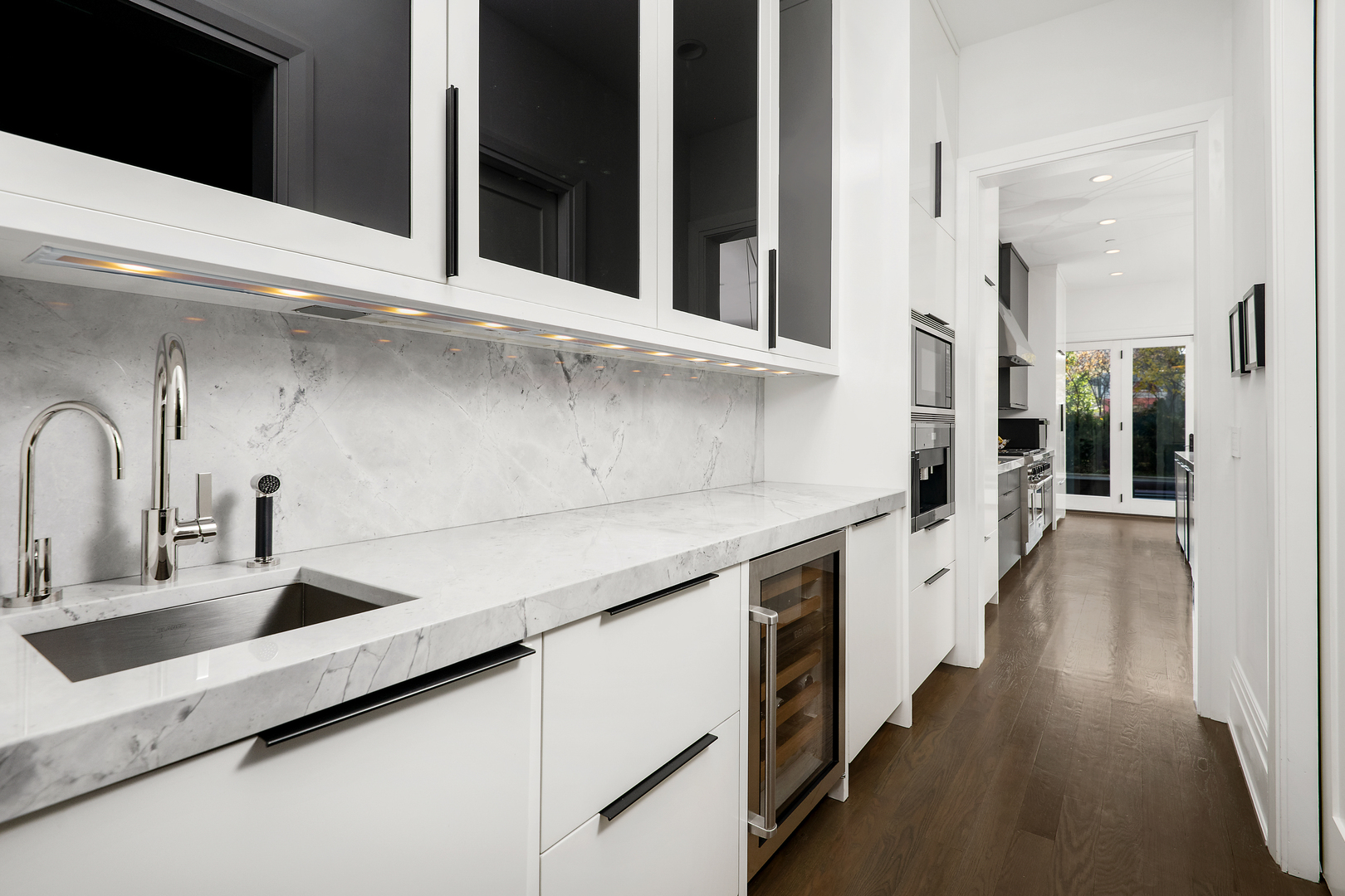 453 West Deming Place Chicago, IL 60614 - Photo 10 of 50 a kitchen with counter top space and wooden floor