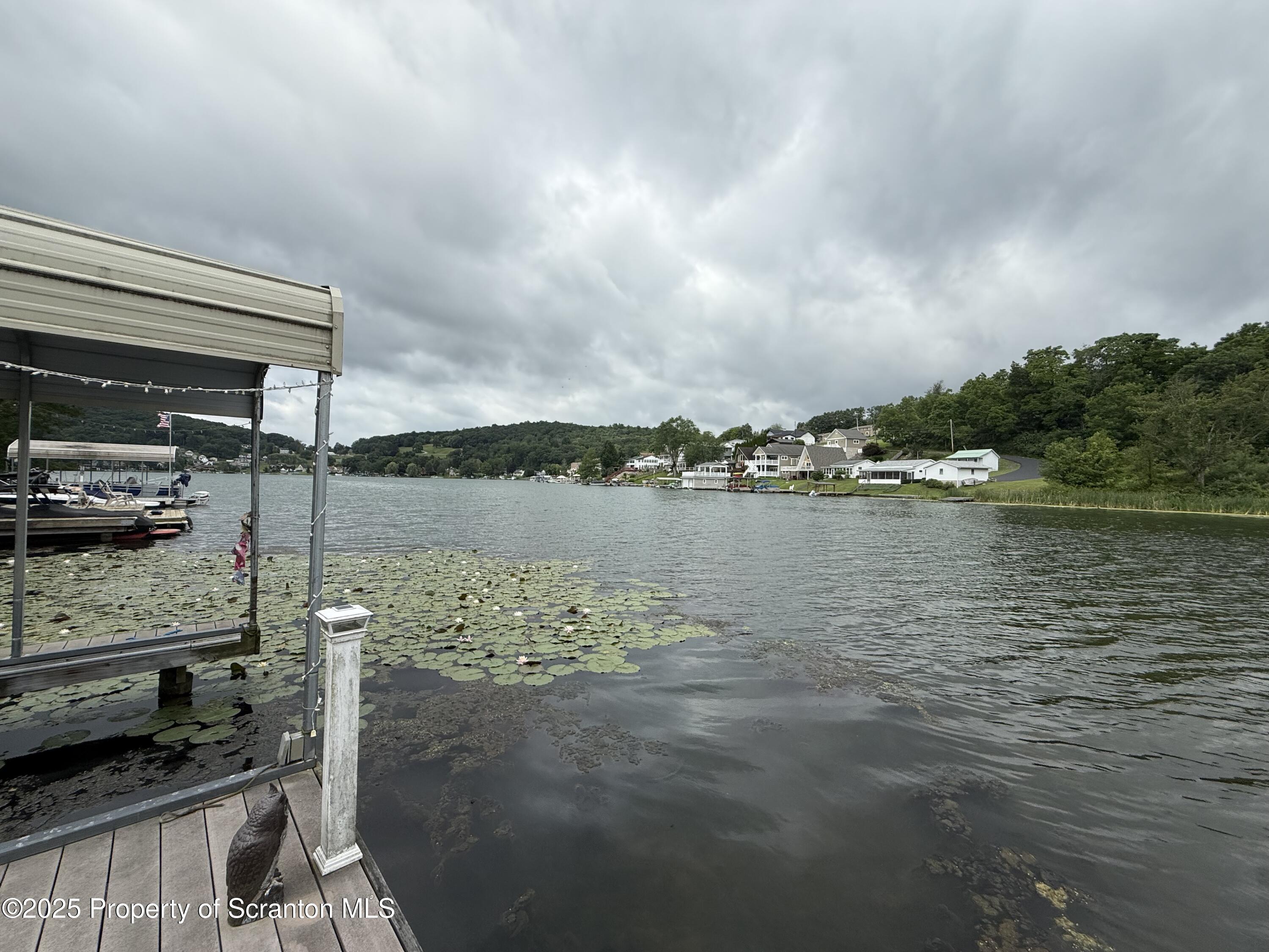186 Point Road Factoryville, PA 18419 - Photo 18 of 22 a view of a lake with a outdoor space