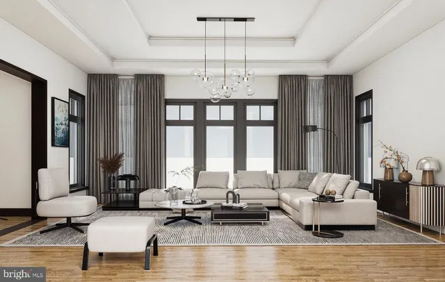 a living room with furniture and large windows