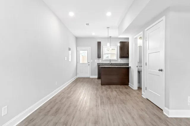 a view of kitchen with wooden floor