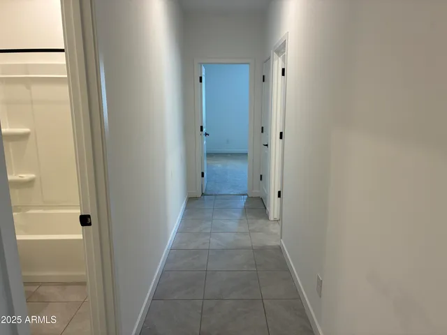 a view of a bathroom from a hallway