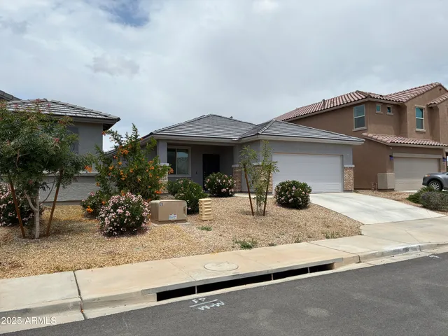 a front view of house with yard outdoor seating and barbeque oven