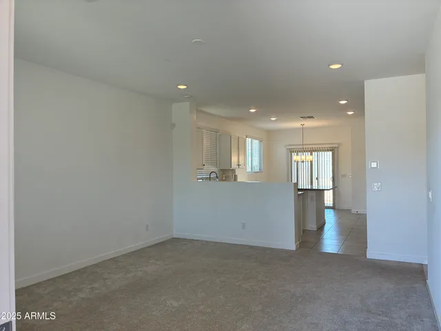 a view of a big room with windows and cabinet
