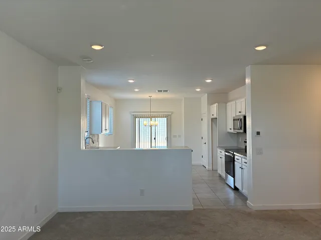 a view of a kitchen cabinets and a window
