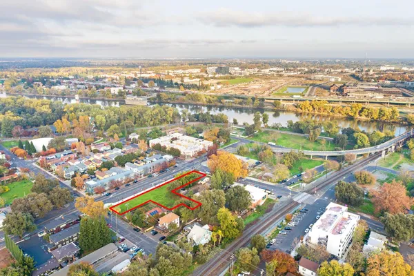 an aerial view of residential houses with outdoor space