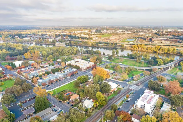 an aerial view of residential building and ocean