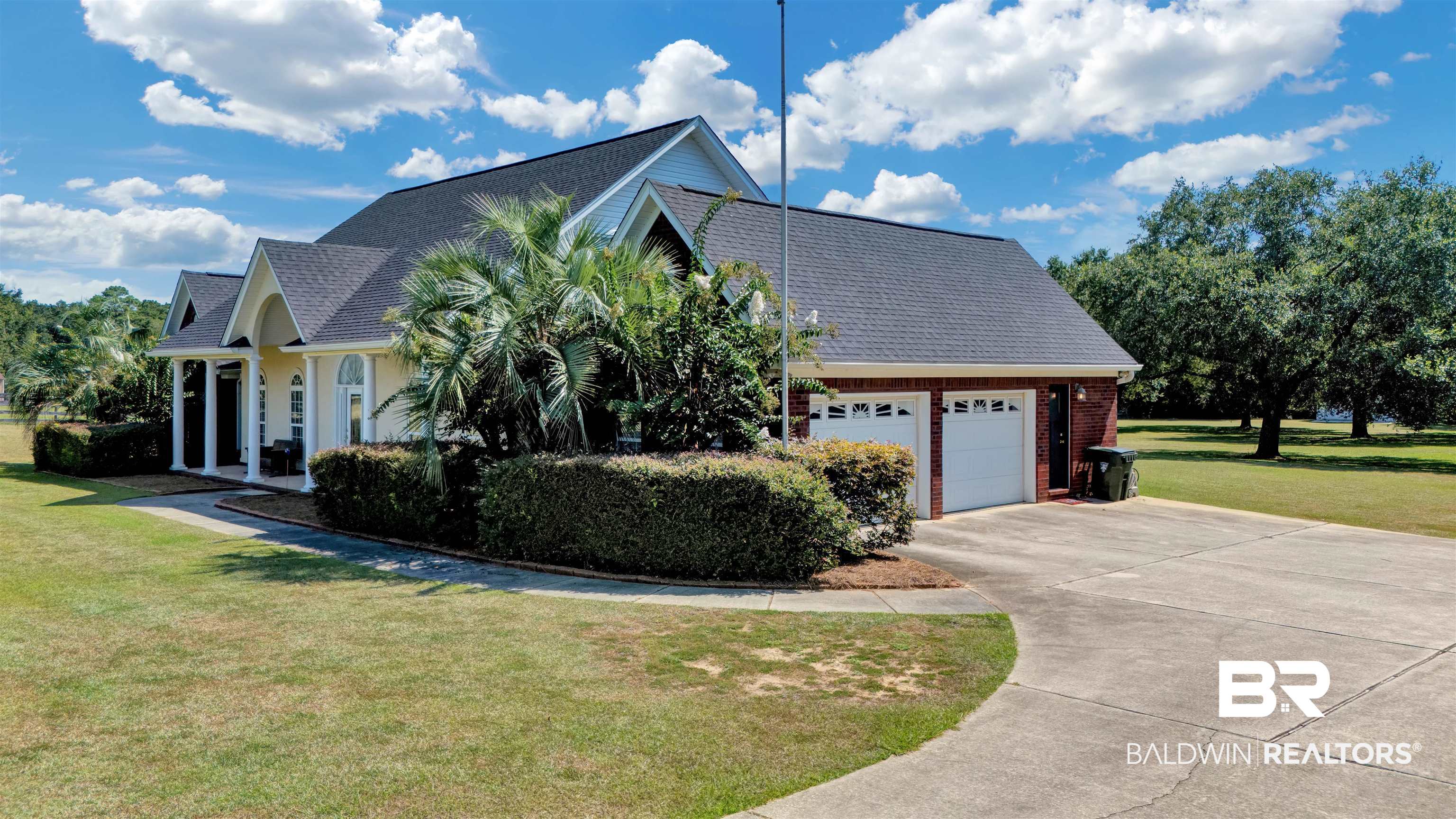 27688 Rigsby Road Daphne, AL 36526 - Photo 50 of 56 View of home's exterior featuring a yard and a garage