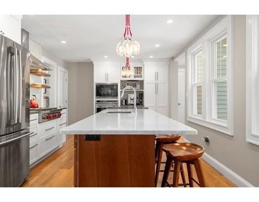45 Avon Road Wellesley, MA 02482 - Photo 6 of 31 a kitchen with kitchen island granite countertop a sink cabinets and stainless steel appliances