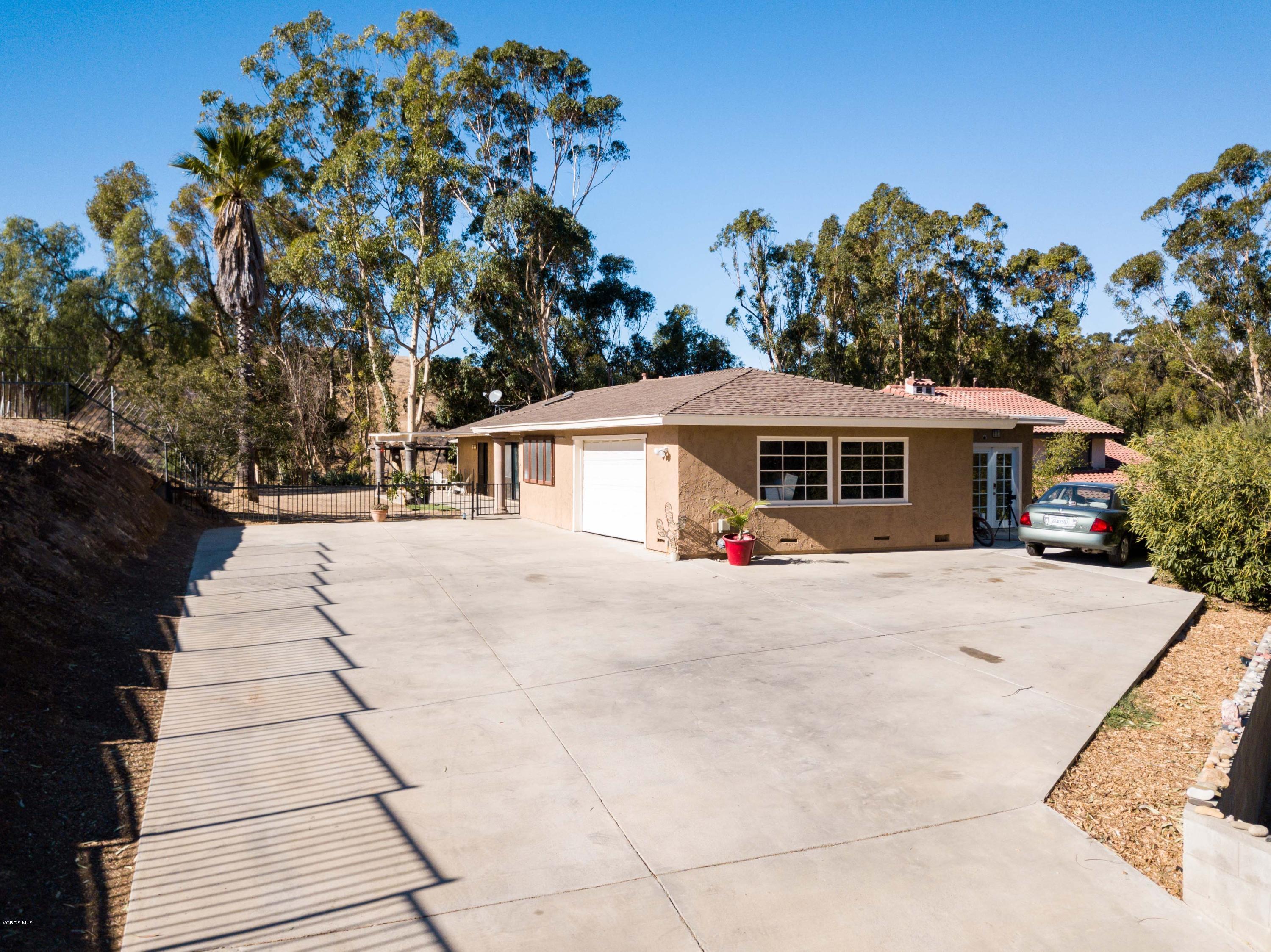 605 Comet Avenue Simi Valley, CA 93065 - Photo 3 of 13 a front view of a house with a garden