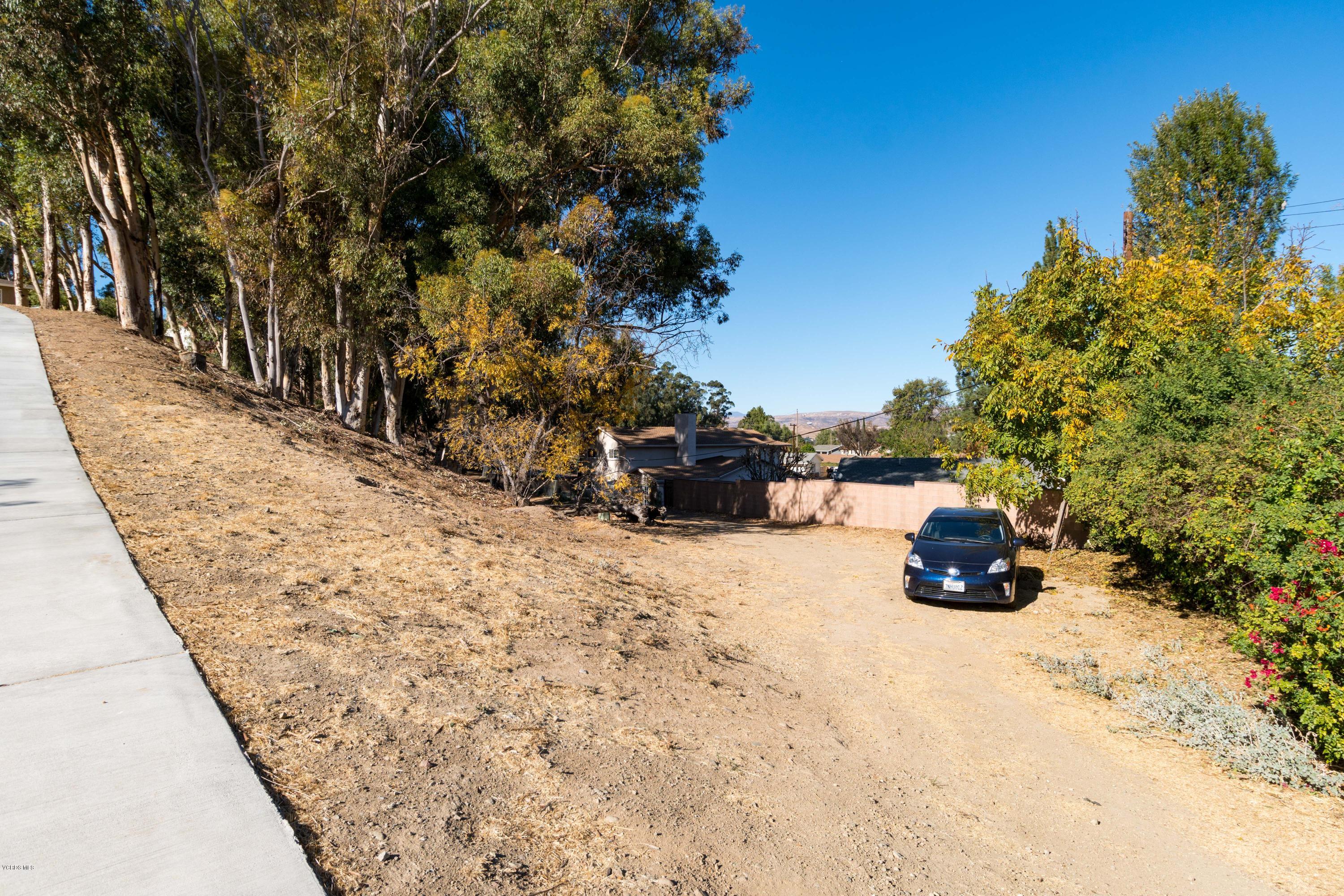 605 Comet Avenue Simi Valley, CA 93065 - Photo 4 of 13 a view of a road with large trees