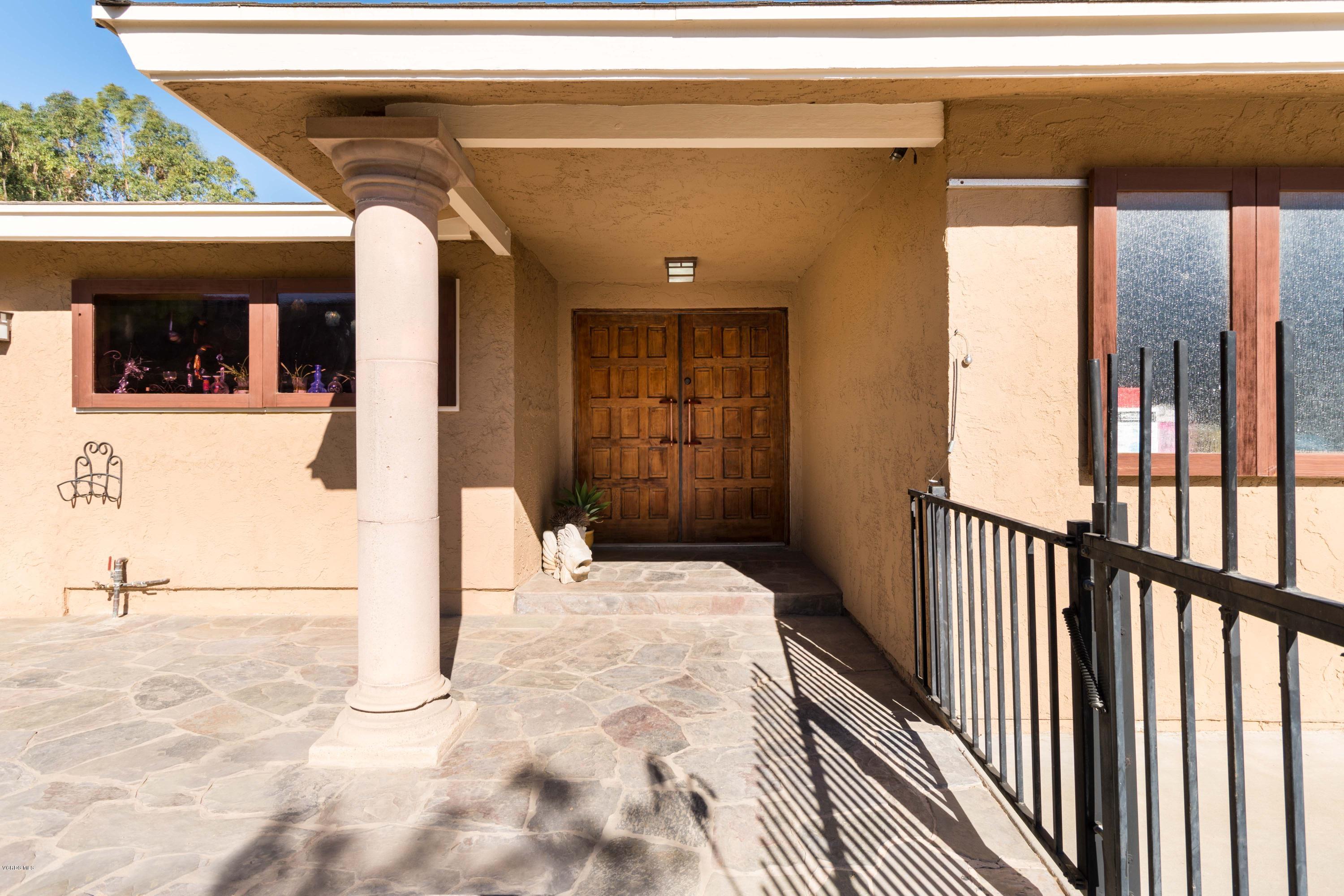 605 Comet Avenue Simi Valley, CA 93065 - Photo 5 of 13 a view of a porch with a table and chairs