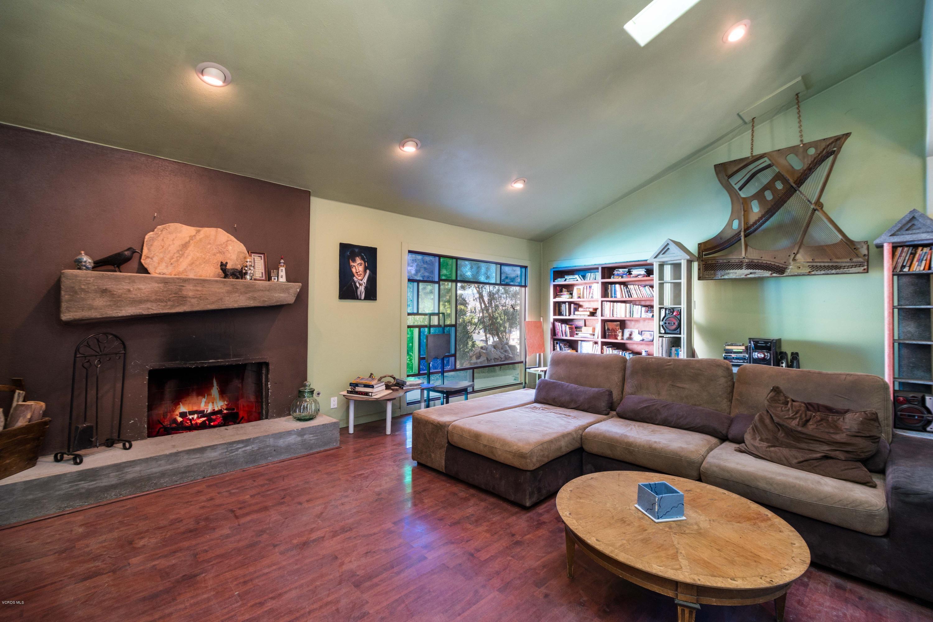 605 Comet Avenue Simi Valley, CA 93065 - Photo 6 of 13 a living room with furniture and a fireplace