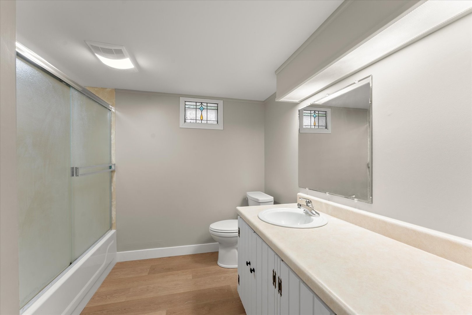 305 South Fair Street Champaign, IL 61821 - Photo 23 of 41 a bathroom with a sink a toilet and shower