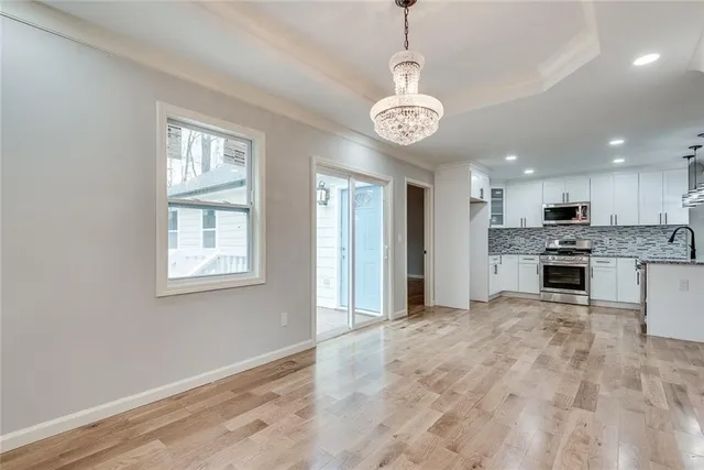 a view of a kitchen with a sink and microwave