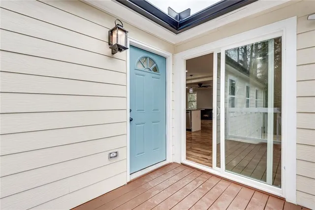 a view of front door and wooden floor