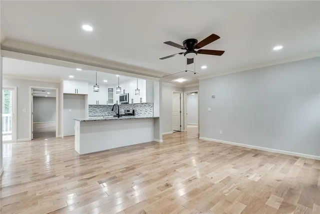 a view of kitchen with refrigerator and window