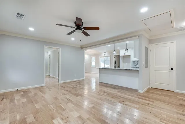 a view of a kitchen with a sink and cabinets
