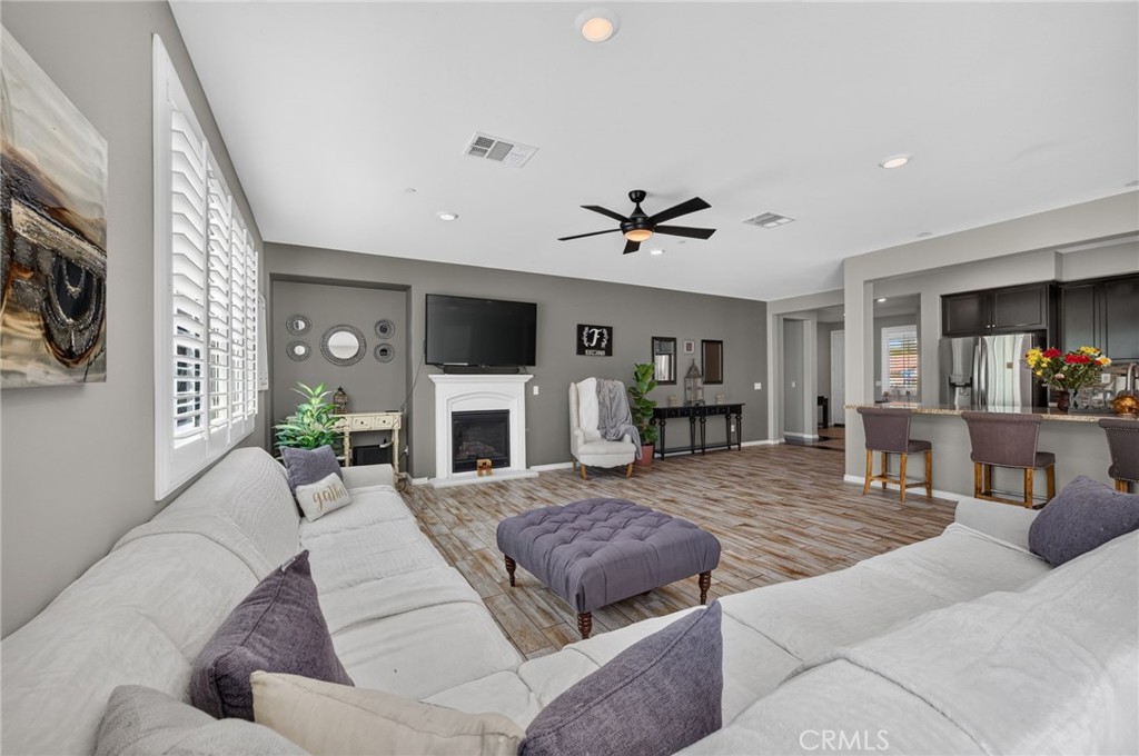 23347 Crystal Way Wildomar, CA 92595 - Photo 25 of 109 a living room with furniture and a fireplace