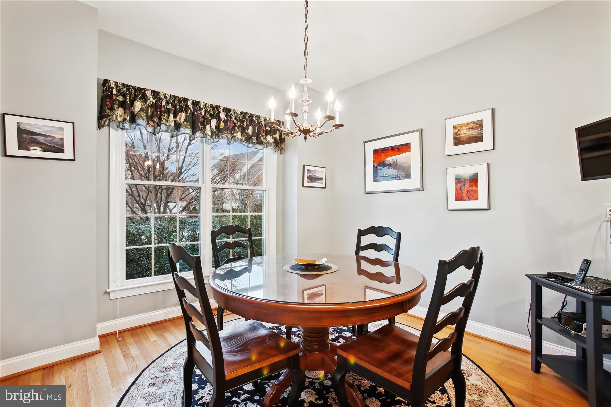 22902 North Brown Square Ashburn, VA 20148 - Photo 11 of 70 a view of a dining room with furniture window and wooden floor