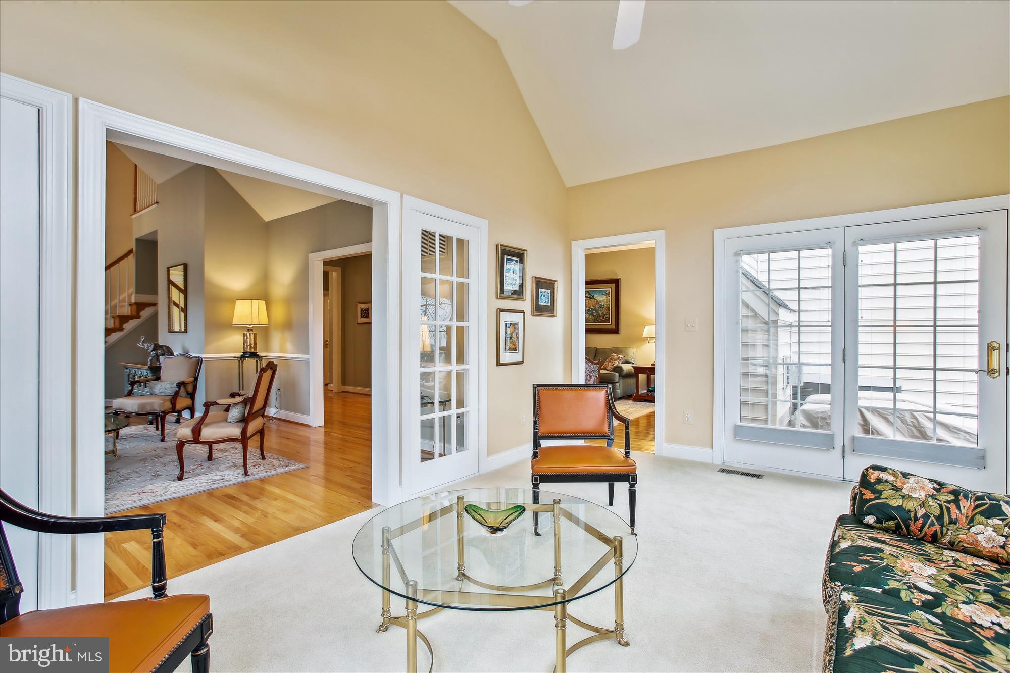 22902 North Brown Square Ashburn, VA 20148 - Photo 23 of 70 a living room with furniture a dining table and a floor to ceiling window