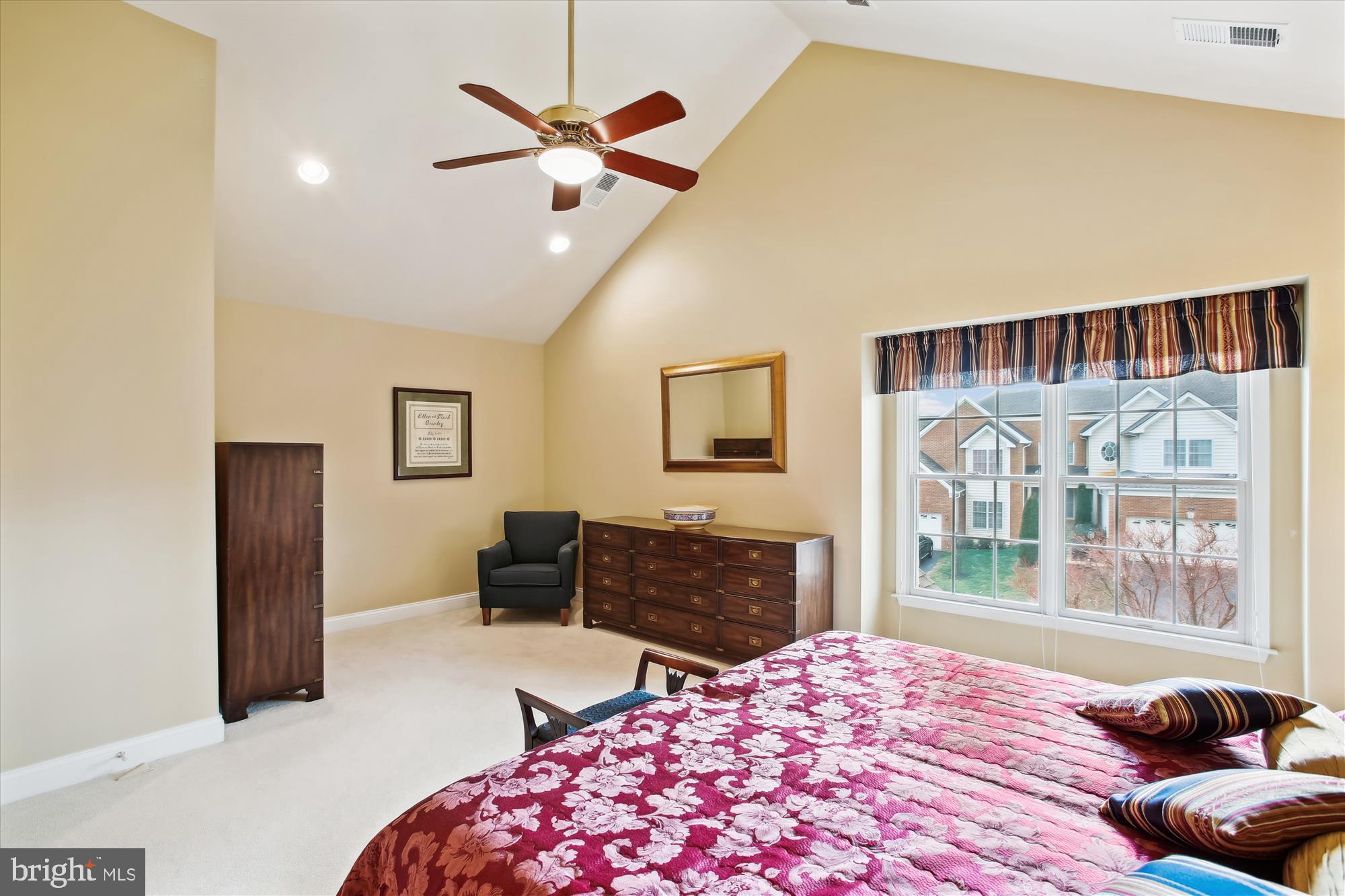 22902 North Brown Square Ashburn, VA 20148 - Photo 26 of 70 a bedroom with a bed and dresser with wooden floor