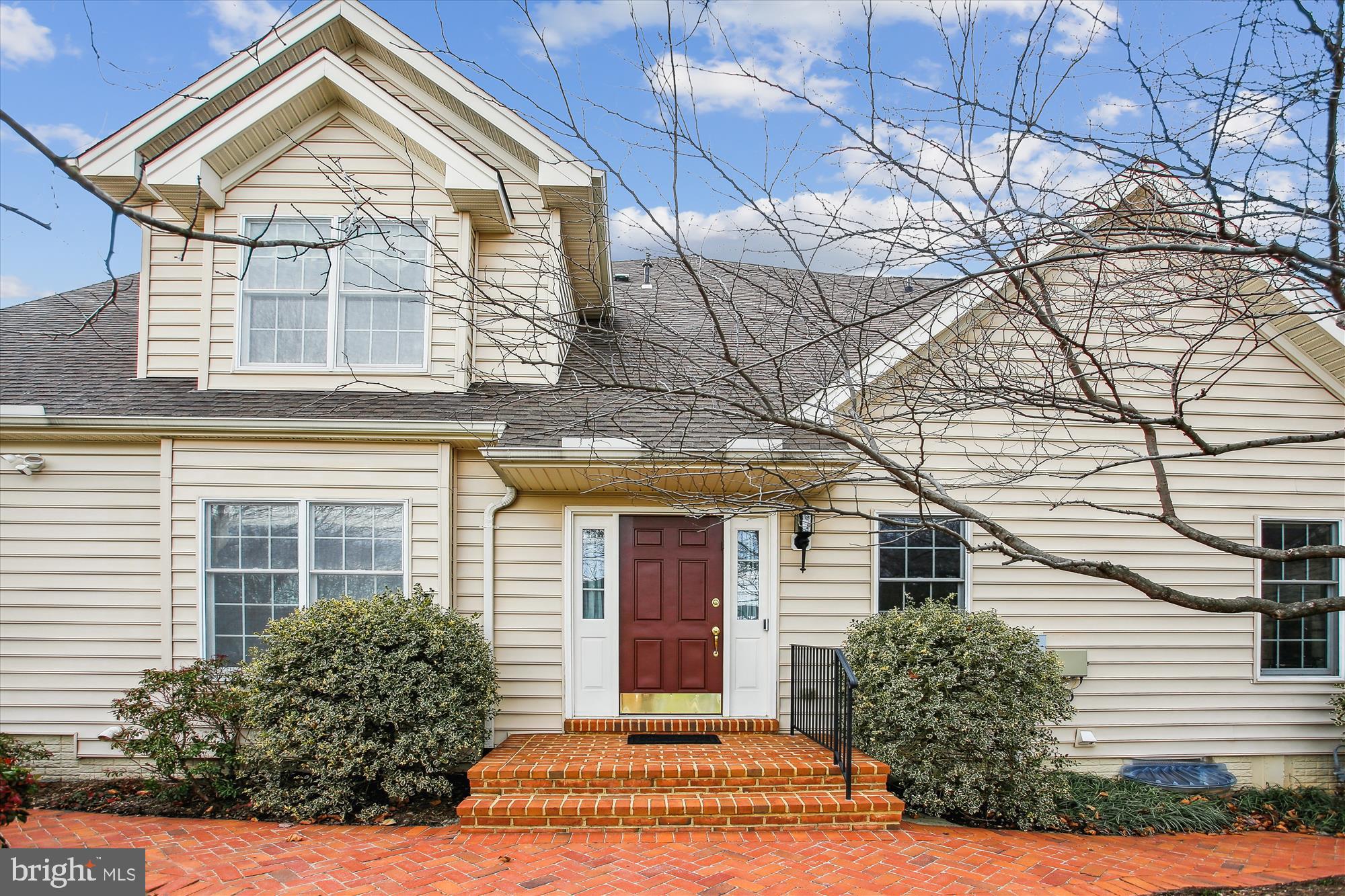 22902 North Brown Square Ashburn, VA 20148 - Photo 3 of 70 a view of a brick house with large windows and a large tree