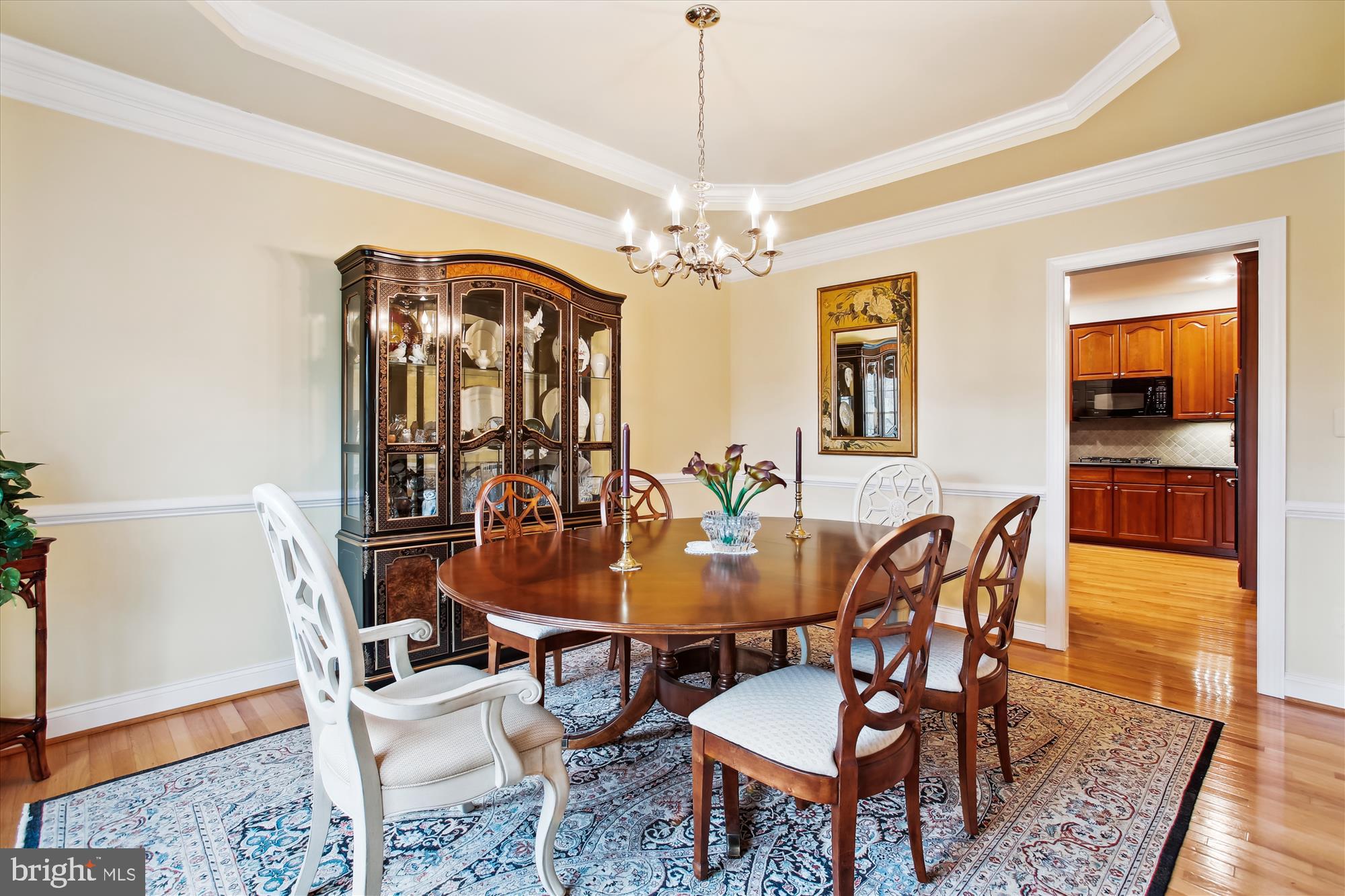 22902 North Brown Square Ashburn, VA 20148 - Photo 4 of 70 a dining room with furniture a chandelier and wooden floor