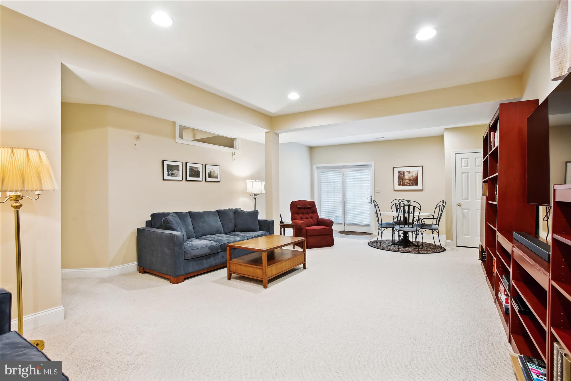 22902 North Brown Square Ashburn, VA 20148 - Photo 41 of 70 a living room with furniture two large window and a flat screen tv