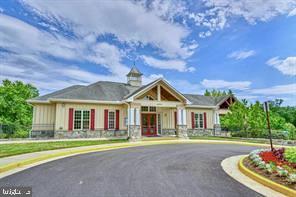 22902 North Brown Square Ashburn, VA 20148 - Photo 67 of 70 a front view of a house with a garden