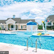 22902 North Brown Square Ashburn, VA 20148 - Photo 69 of 70 a view of a house with pool and a yard