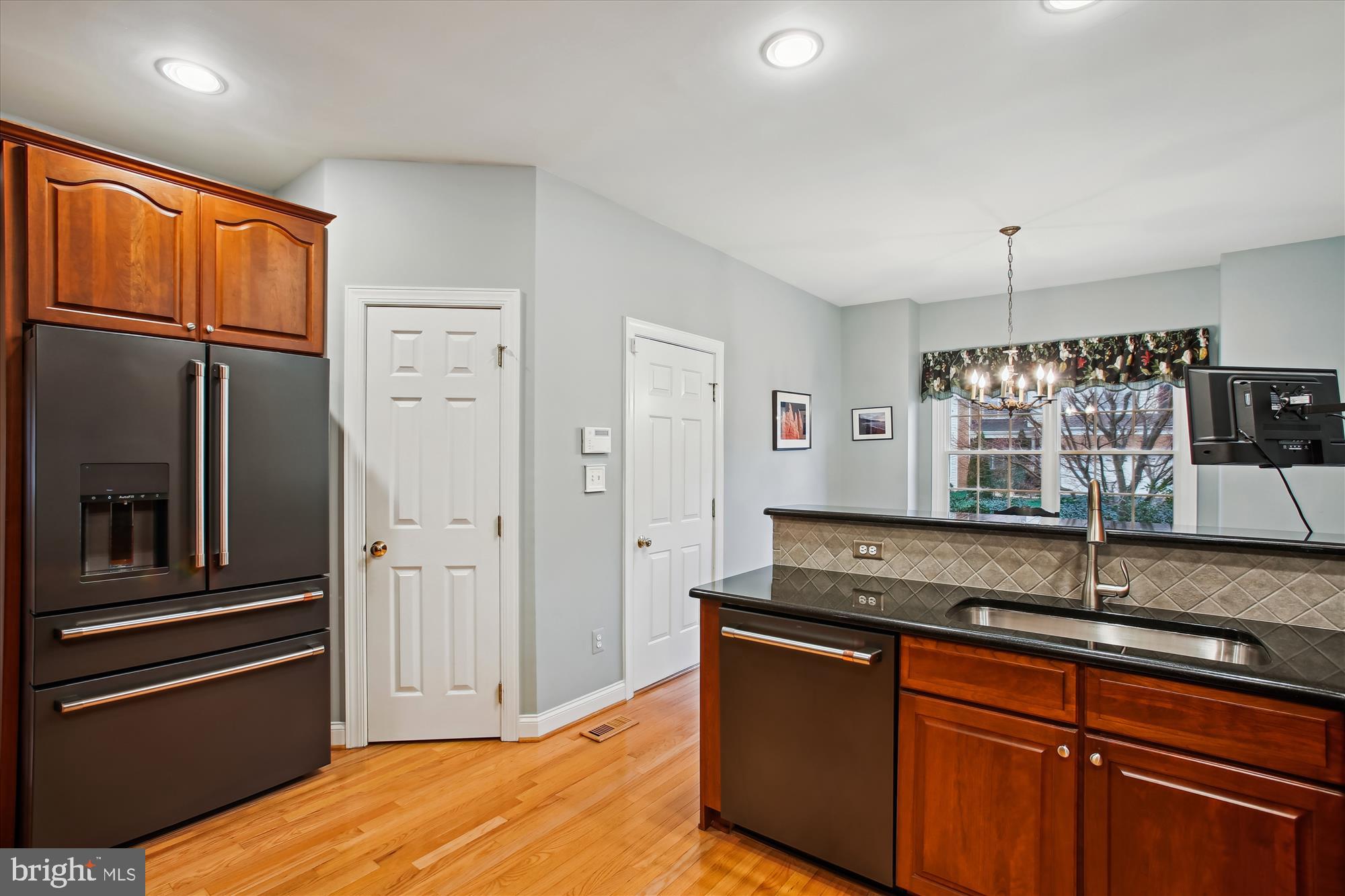 22902 North Brown Square Ashburn, VA 20148 - Photo 9 of 70 a kitchen with stainless steel appliances granite countertop a refrigerator and a sink