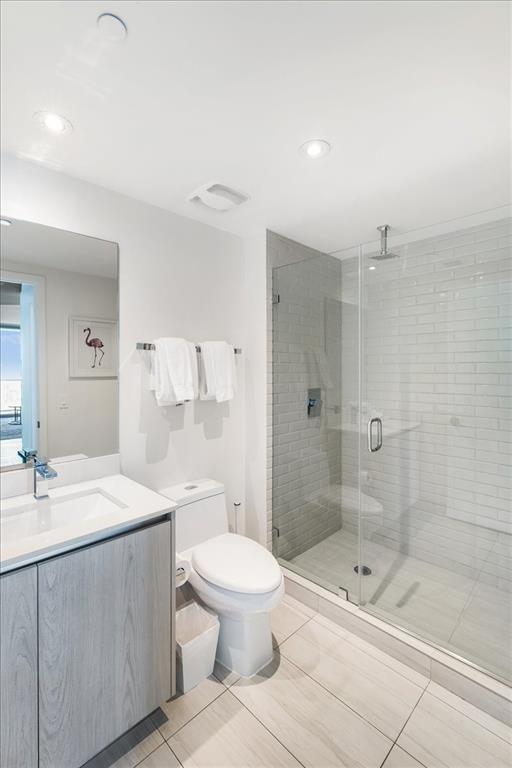 4010 South Ocean Drive, Unit R1102 Hollywood, FL 33019 - Photo 29 of 47 a bathroom with a sink a toilet and shower