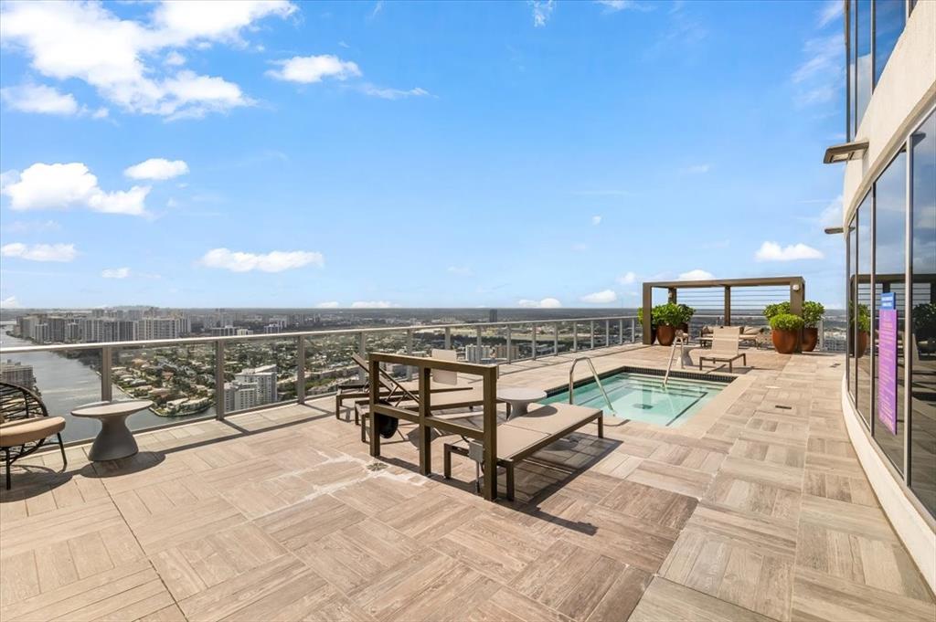4010 South Ocean Drive, Unit R1102 Hollywood, FL 33019 - Photo 32 of 47 a view of a terrace with sitting area