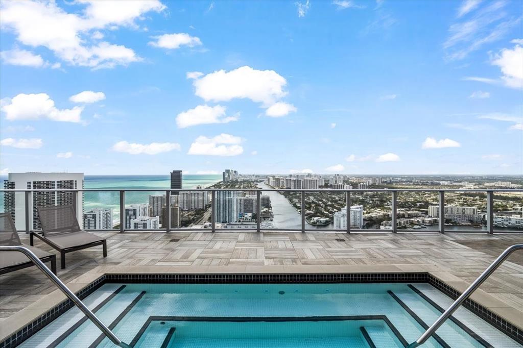 4010 South Ocean Drive, Unit R1102 Hollywood, FL 33019 - Photo 34 of 47 a view of a swimming pool with a terrace