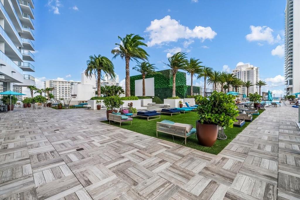 4010 South Ocean Drive, Unit R1102 Hollywood, FL 33019 - Photo 42 of 47 a view of a garden with potted plants