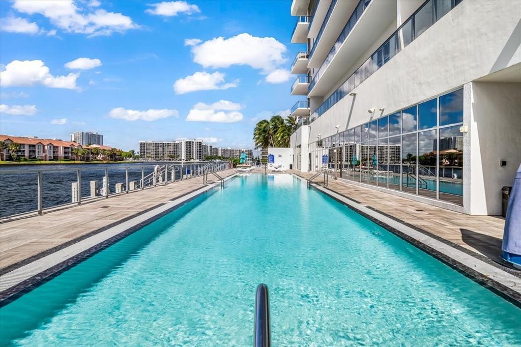 4010 South Ocean Drive, Unit R1102 Hollywood, FL 33019 - Photo 46 of 47 a view of a house with swimming pool