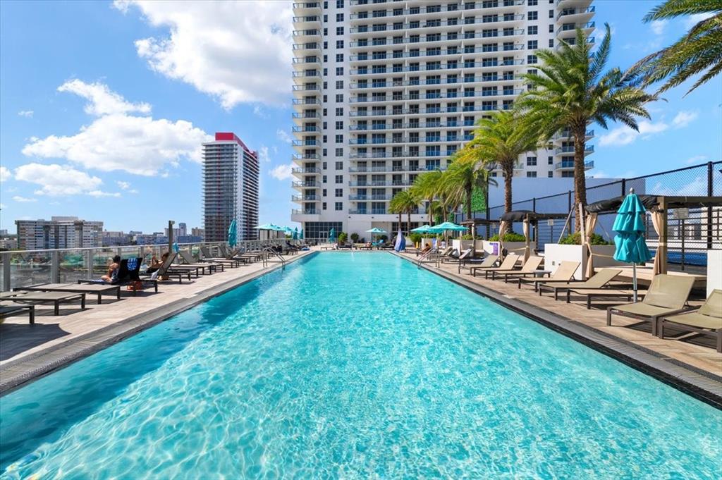 4010 South Ocean Drive, Unit R1102 Hollywood, FL 33019 - Photo 47 of 47 a city view with tall buildings and a yard