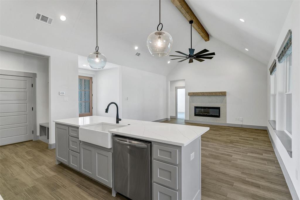 2029 Rattler Way Tolar, TX 76476 - Photo 15 of 28 a view of living room kitchen with a sink and dishwasher
