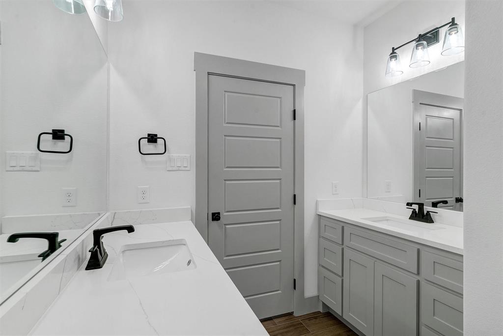2029 Rattler Way Tolar, TX 76476 - Photo 25 of 28 a bathroom with a sink and a tub