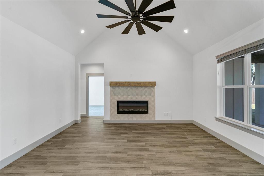 2029 Rattler Way Tolar, TX 76476 - Photo 8 of 28 a view of a livingroom with a fireplace and window