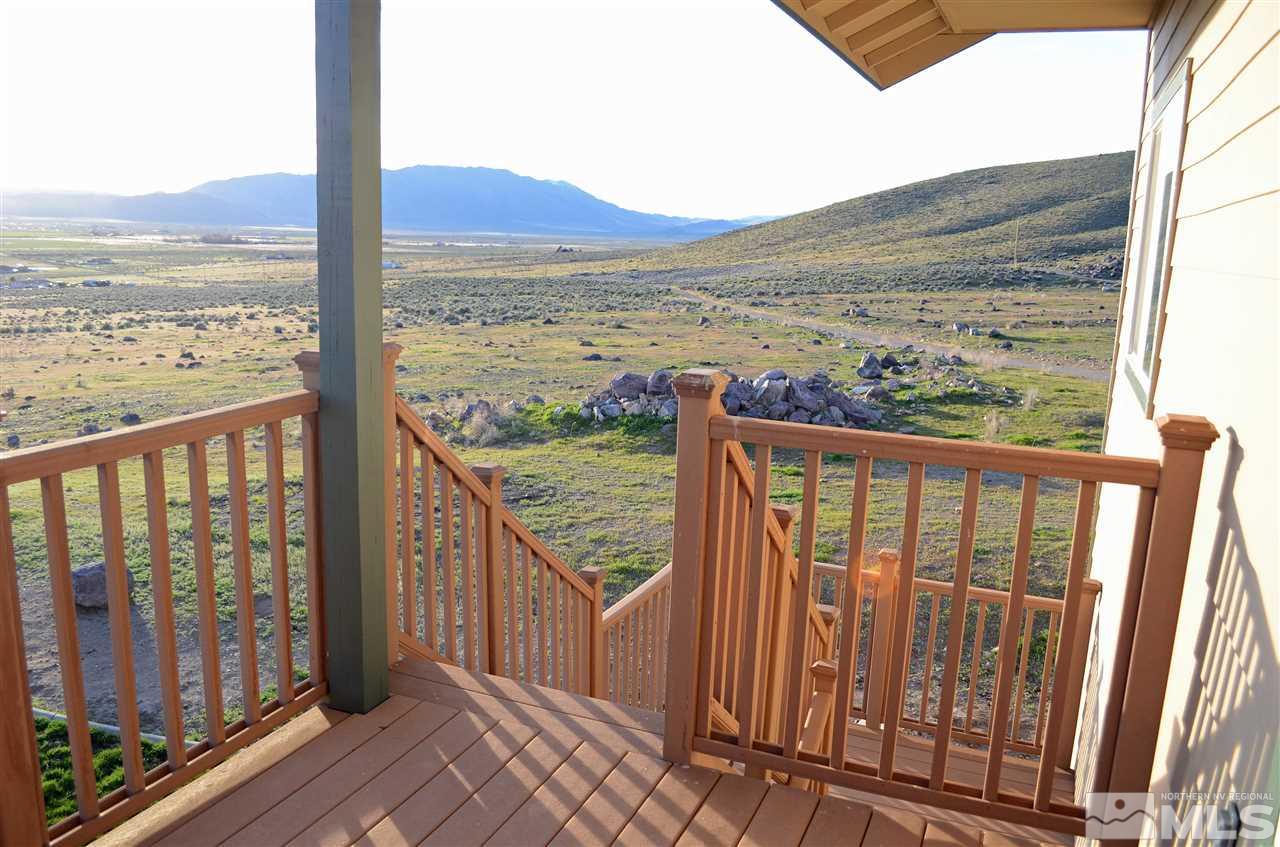 5100 Wayside Road Reno, NV 89510 - Photo 13 of 25 a view of a balcony with wooden floor next to a yard