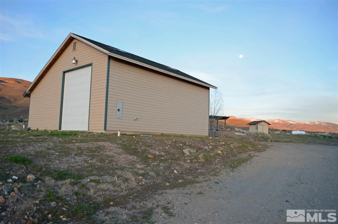 5100 Wayside Road Reno, NV 89510 - Photo 23 of 25 a front view of house with yard and car parked