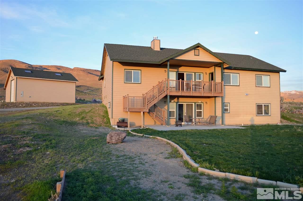 5100 Wayside Road Reno, NV 89510 - Photo 4 of 25 a front view of a house with a yard