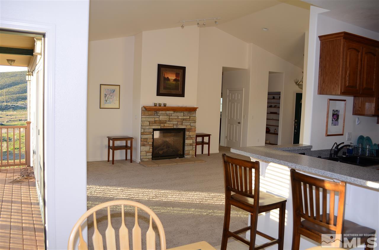5100 Wayside Road Reno, NV 89510 - Photo 6 of 25 a living room with furniture and a fireplace
